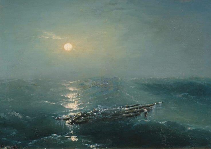В море